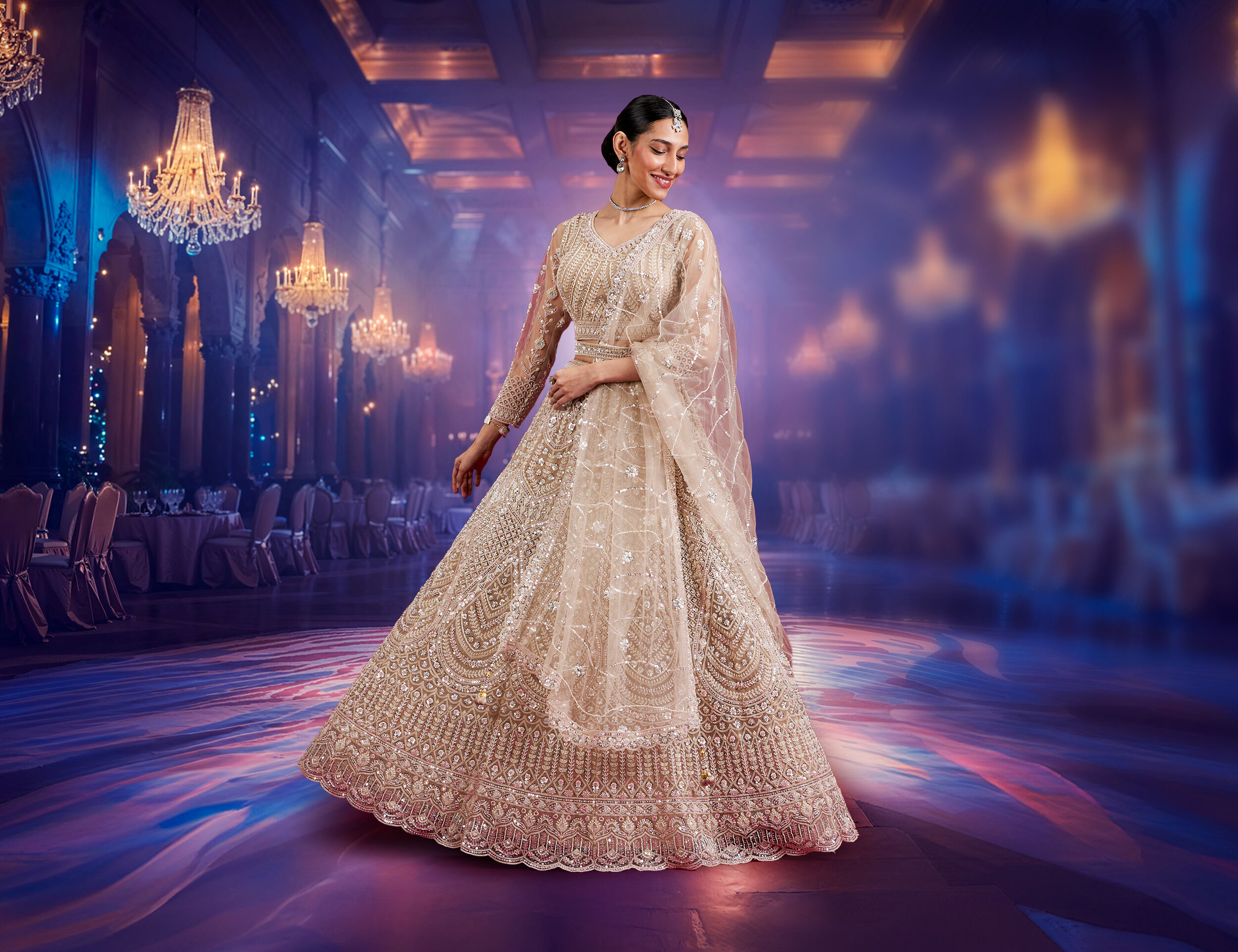 Women wearing embroidered lehenga with gold zari border, showcasing a modern bridal trend. Women wearing embroidered lehenga with gold zari border, showcasing a modern bridal trend.